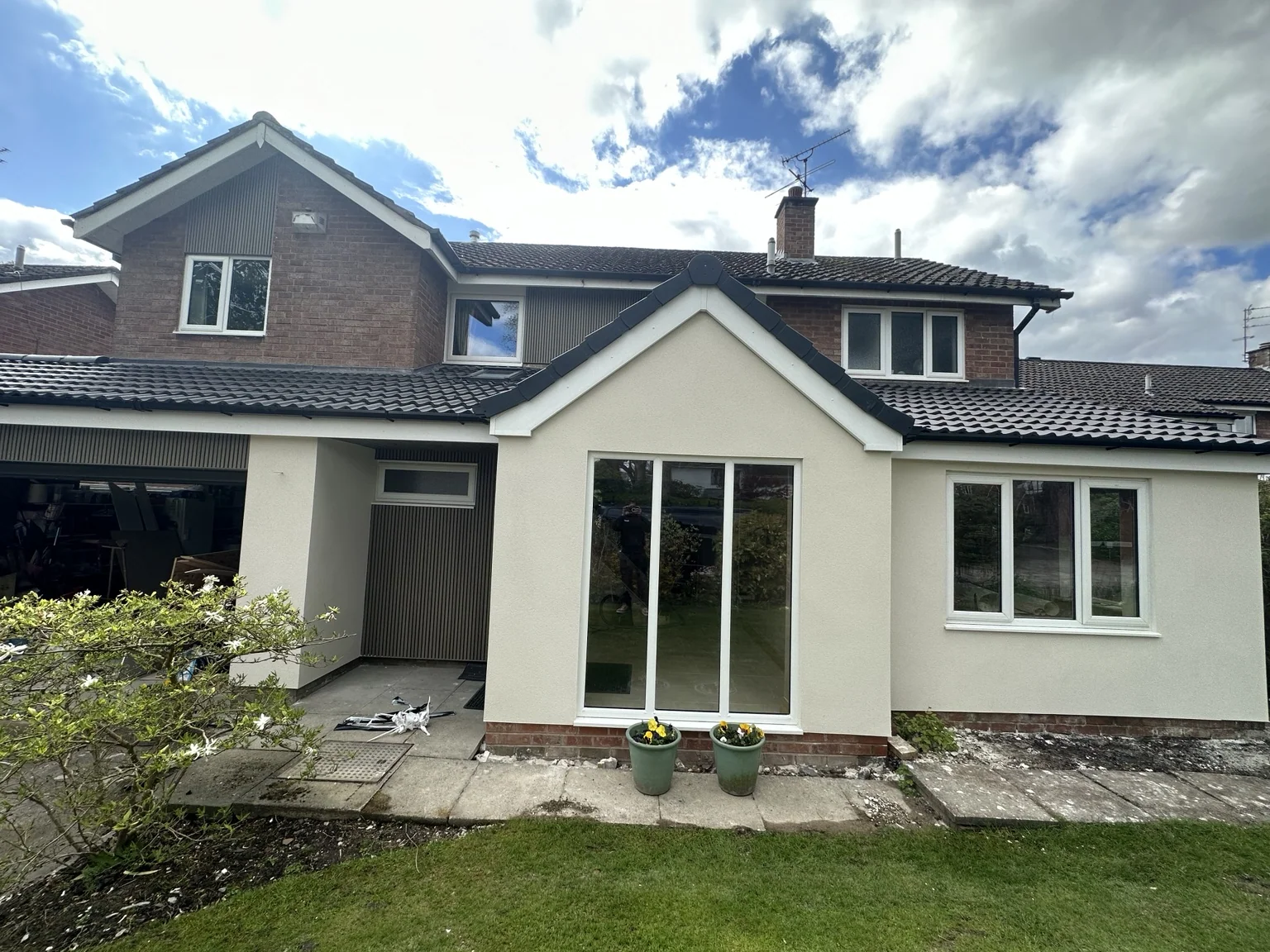 Completed white-rendered home extension